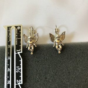 Silver angel lever back earrings.